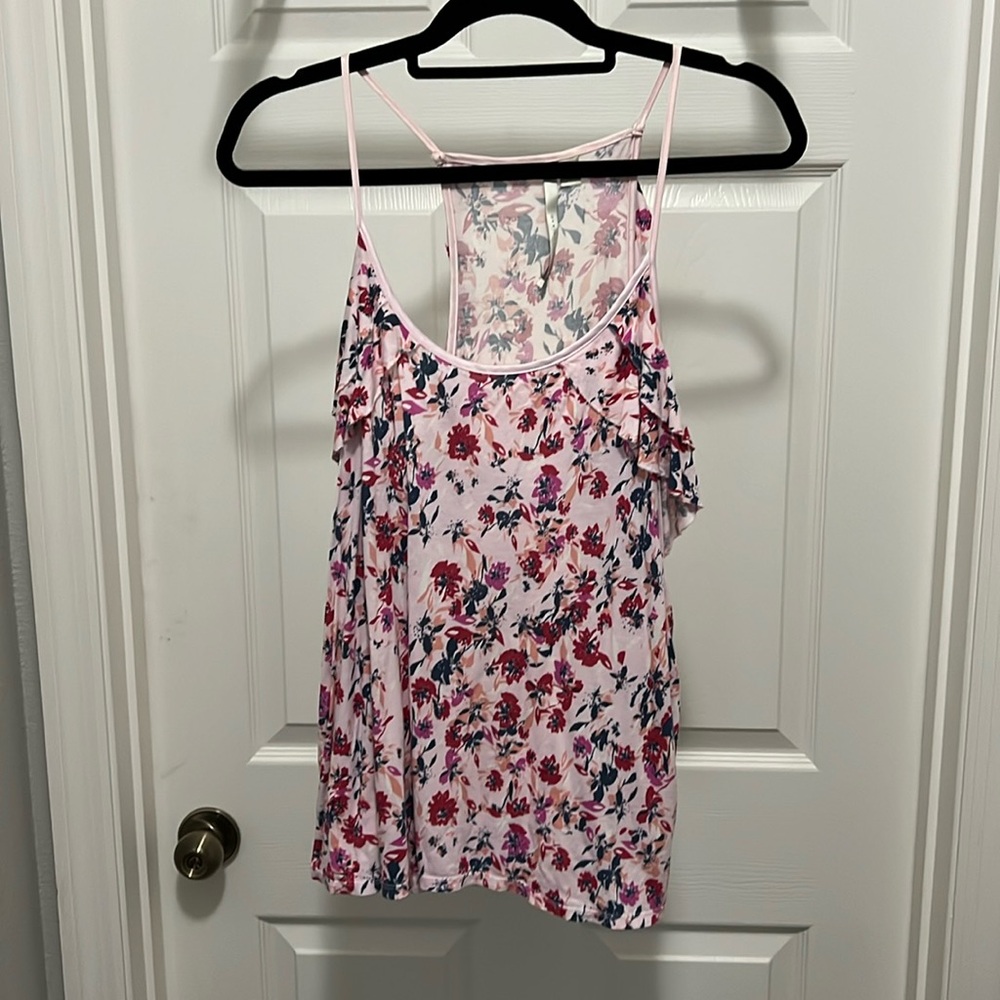 Like New pink flower patterned  tank top with flutter detail around arms